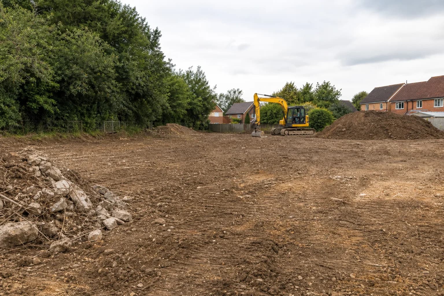 Development plot being cleared of vegetation and debris ready for groundworks